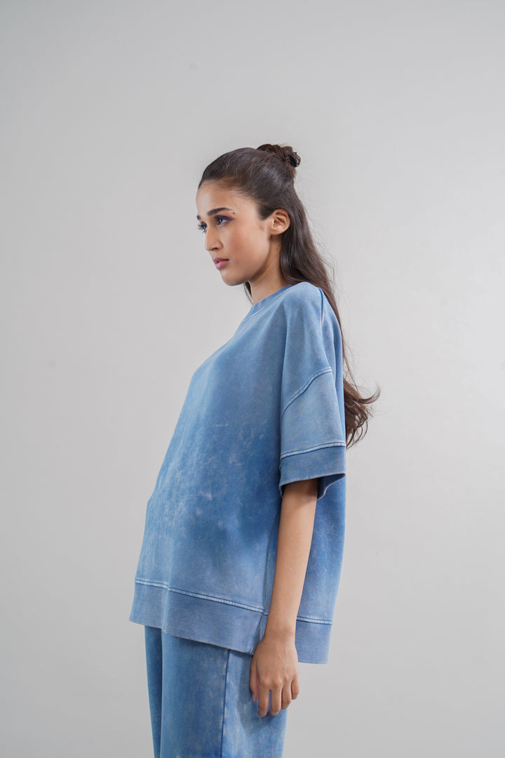Denim wash 100% cotton terry sweatshirt on a model.