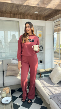 Stylish woman in Sunday Bamboo Terry Travel Set with coffee.
