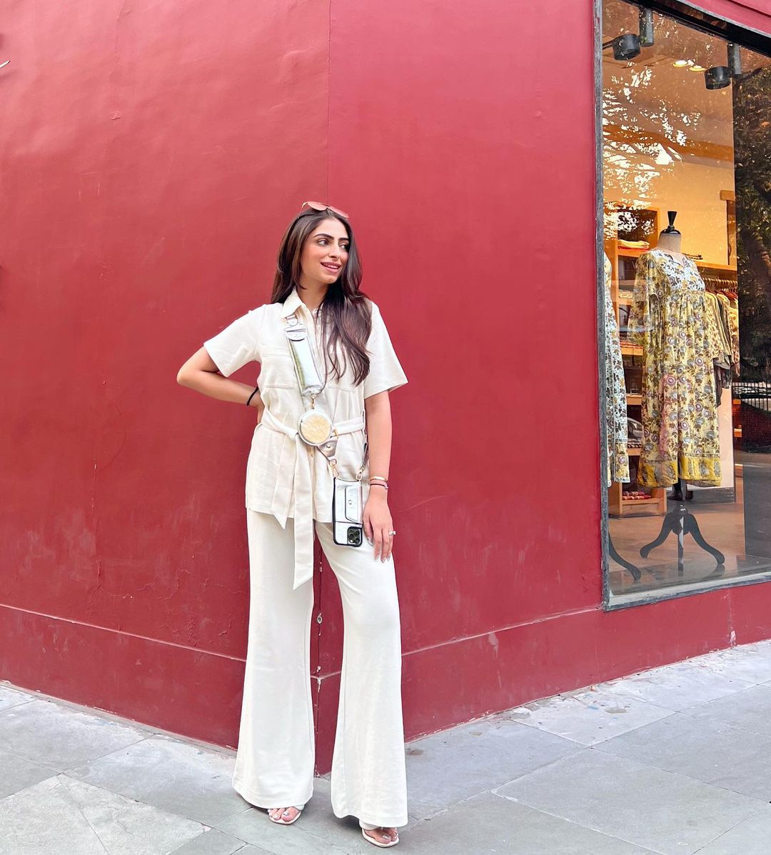 Mini Waffle Ivory Safari Suit styled with fashionable accessories against a vibrant backdrop.