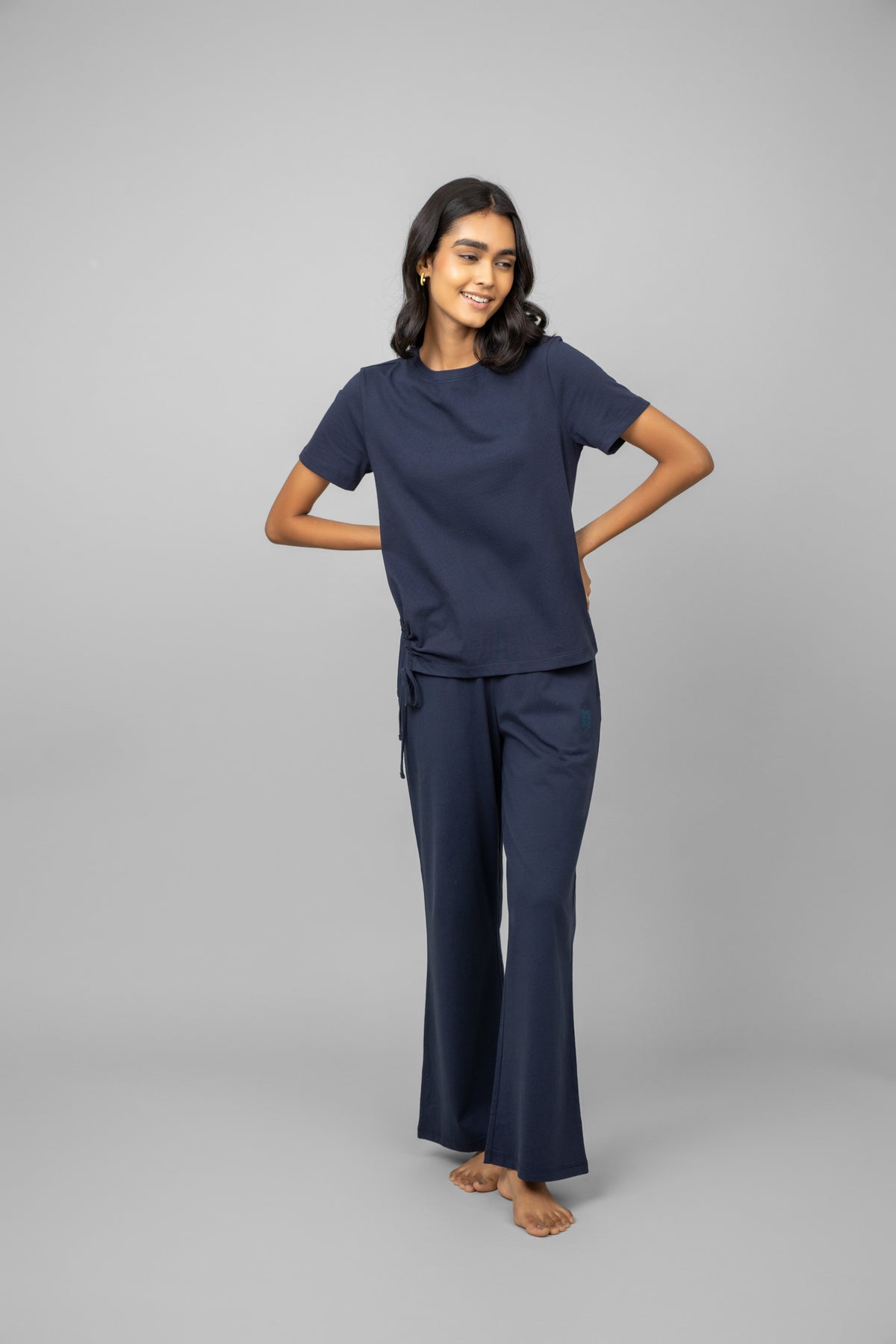 Model wearing Navy Essential Flared Loungers in casual pose.