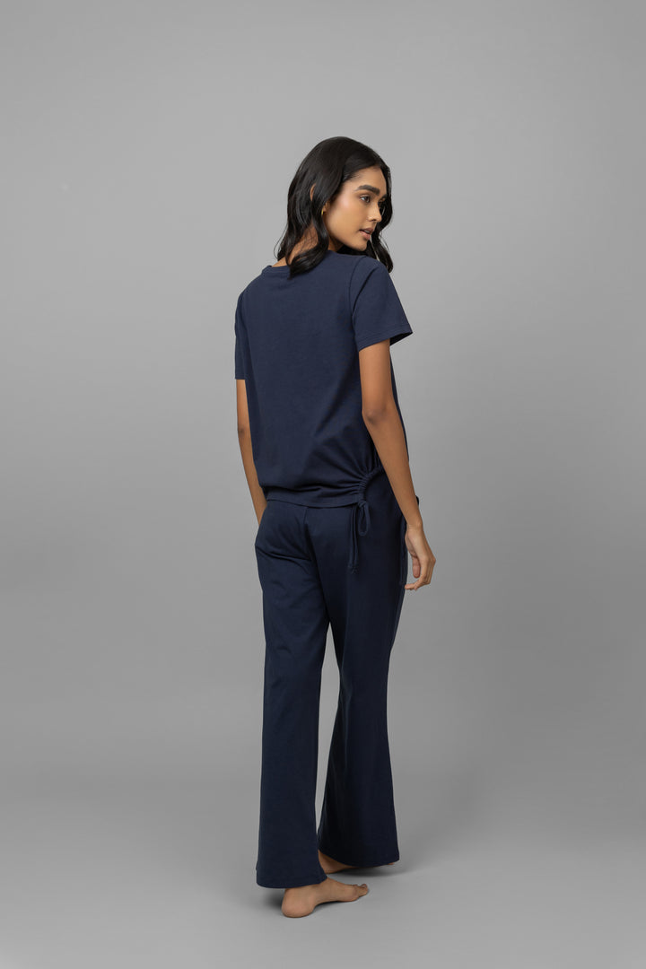 Model showcasing the Navy Essential Flared Lounge Set, back view.