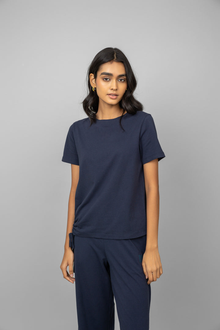 Cotton side ruched navy t-shirt on a model.
