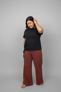 Ruby Essential Flared Lounge Set featuring a relaxed black top and red pants.