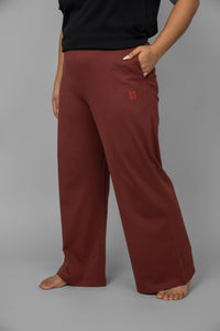 Ruby Essential Flared Loungers in deep red with pockets.