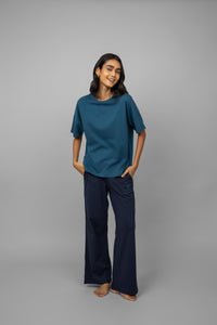 Teal top and navy logo pants set for stylish comfort.