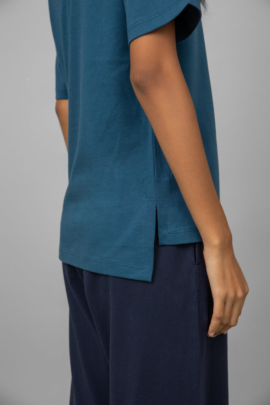 Teal oversized cotton tee with stylish side slits and relaxed fit.