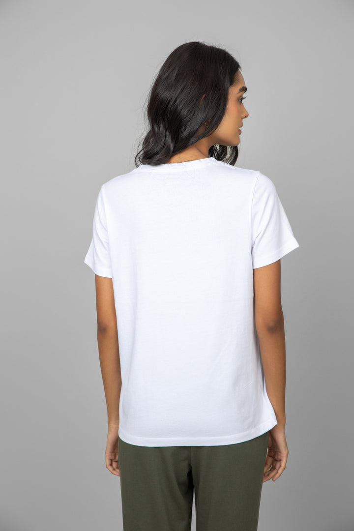 Back view of a model wearing a white V-neck tee.