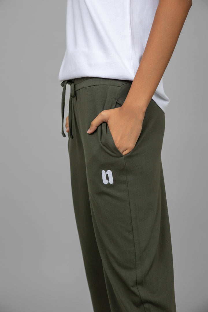 White v-neck jogger set featuring stylish olive green pants.