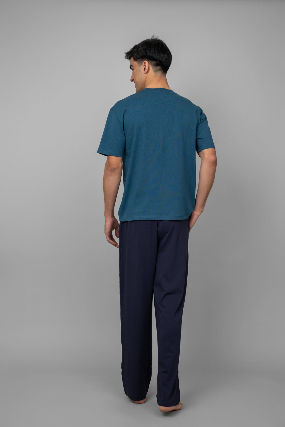 Dark navy men's pajama set with short sleeves and long pants.
