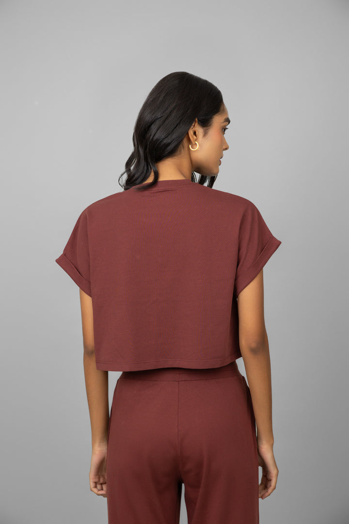 Ruby crop top viewed from the back, featuring short sleeves.