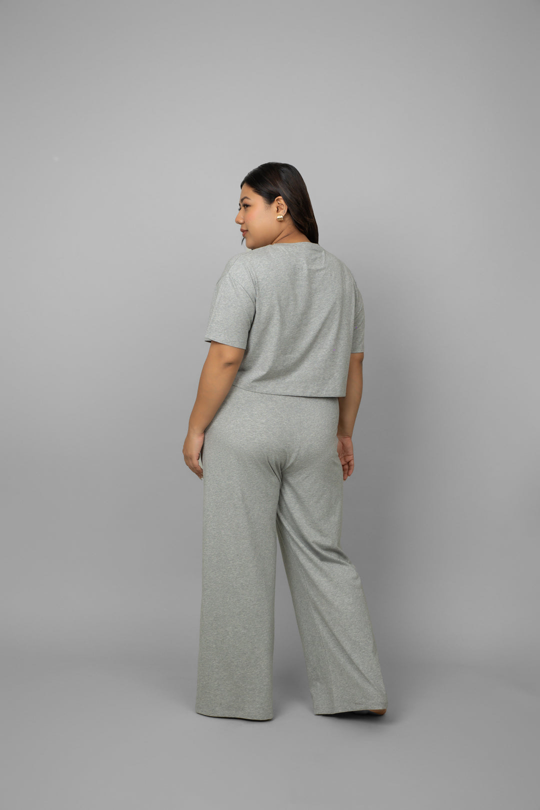 Grey melange cotton Lycra crop co-ord set, back view on model.