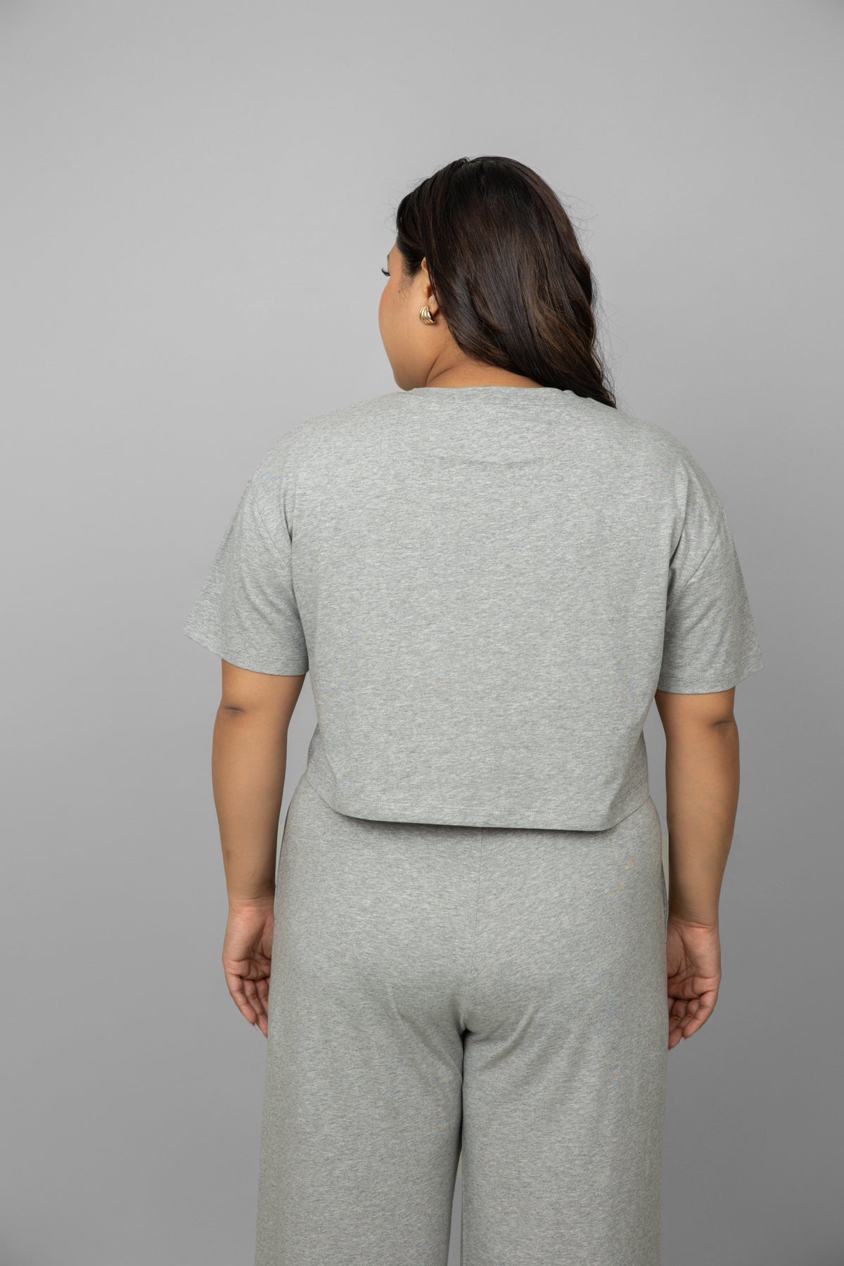 Back view of stylish grey mélange crop top for women.