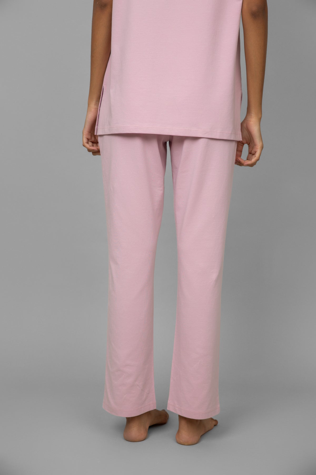 Blush pink lounge pants for comfortable, casual wear at home.