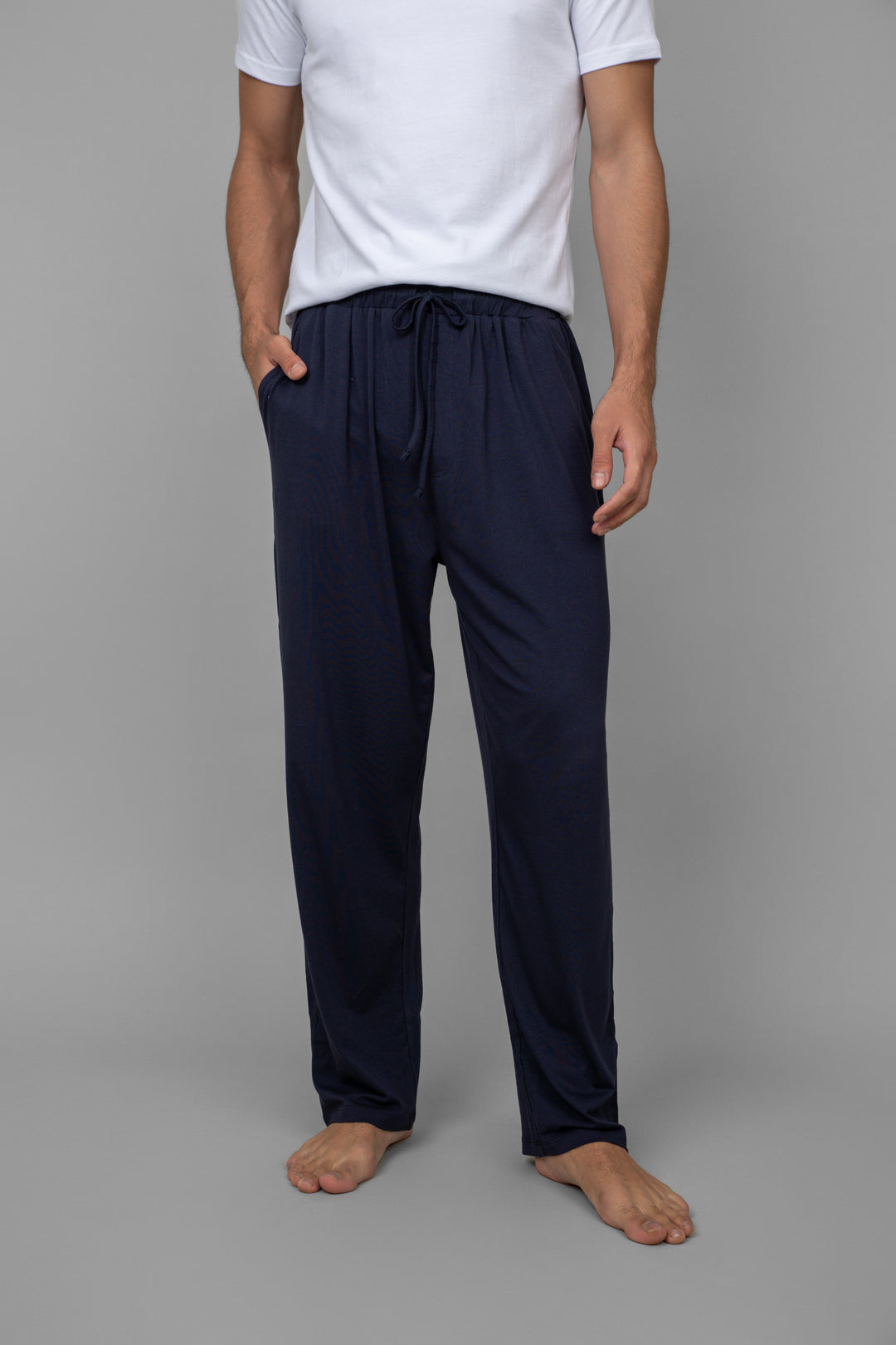 White men's lounger set with navy pants and casual t-shirt.