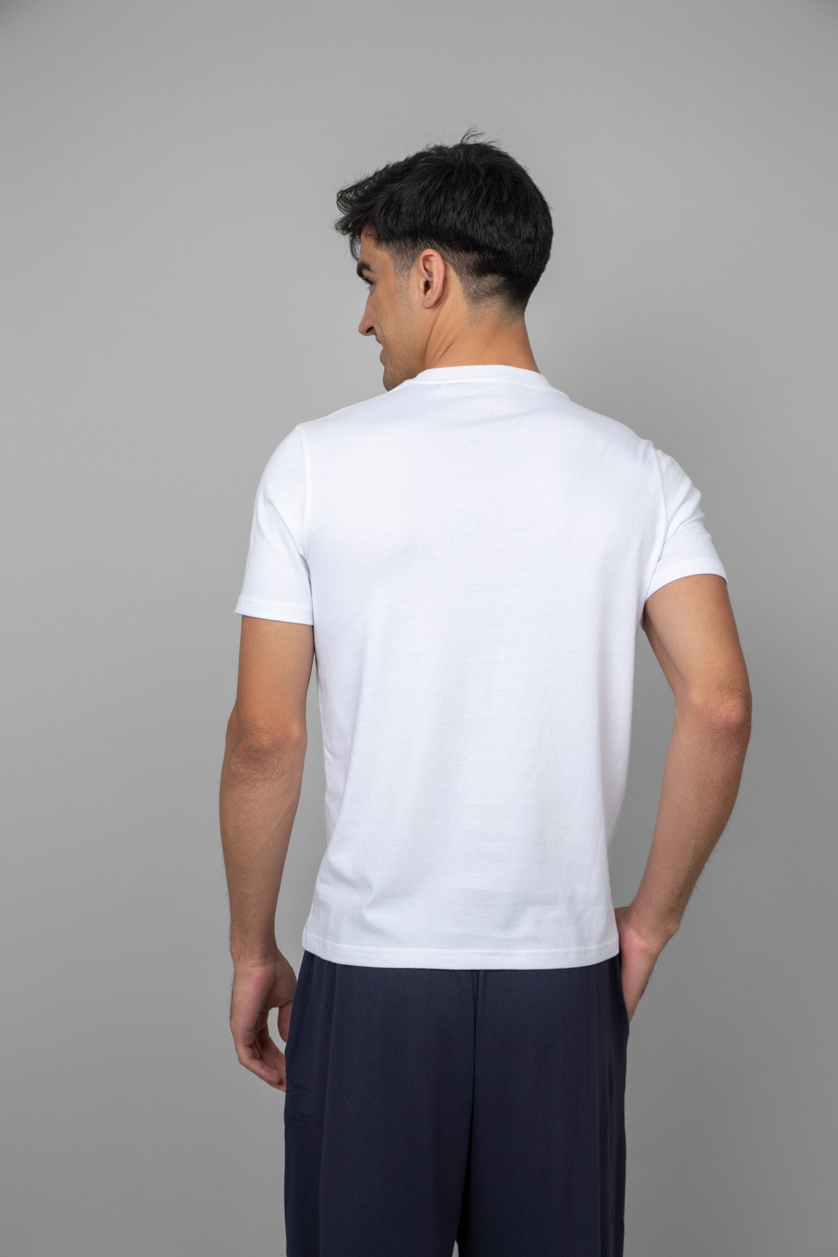 Back view of a white men's essential T-shirt.