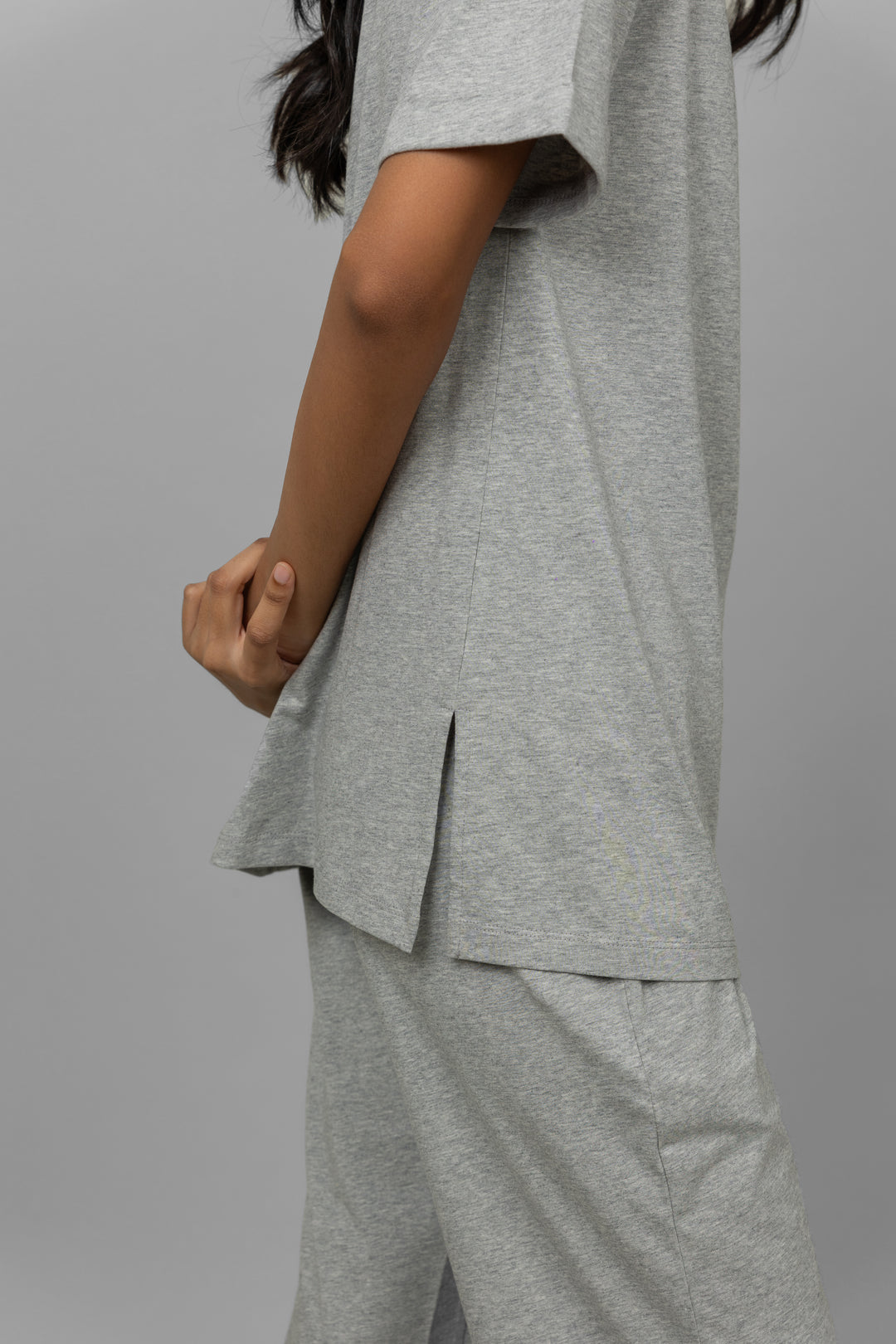 Grey melange cotton lycra pajama set with side slit detail.