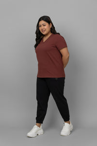 Rust V-neck jogger set, stylish and comfortable women's loungewear outfit.