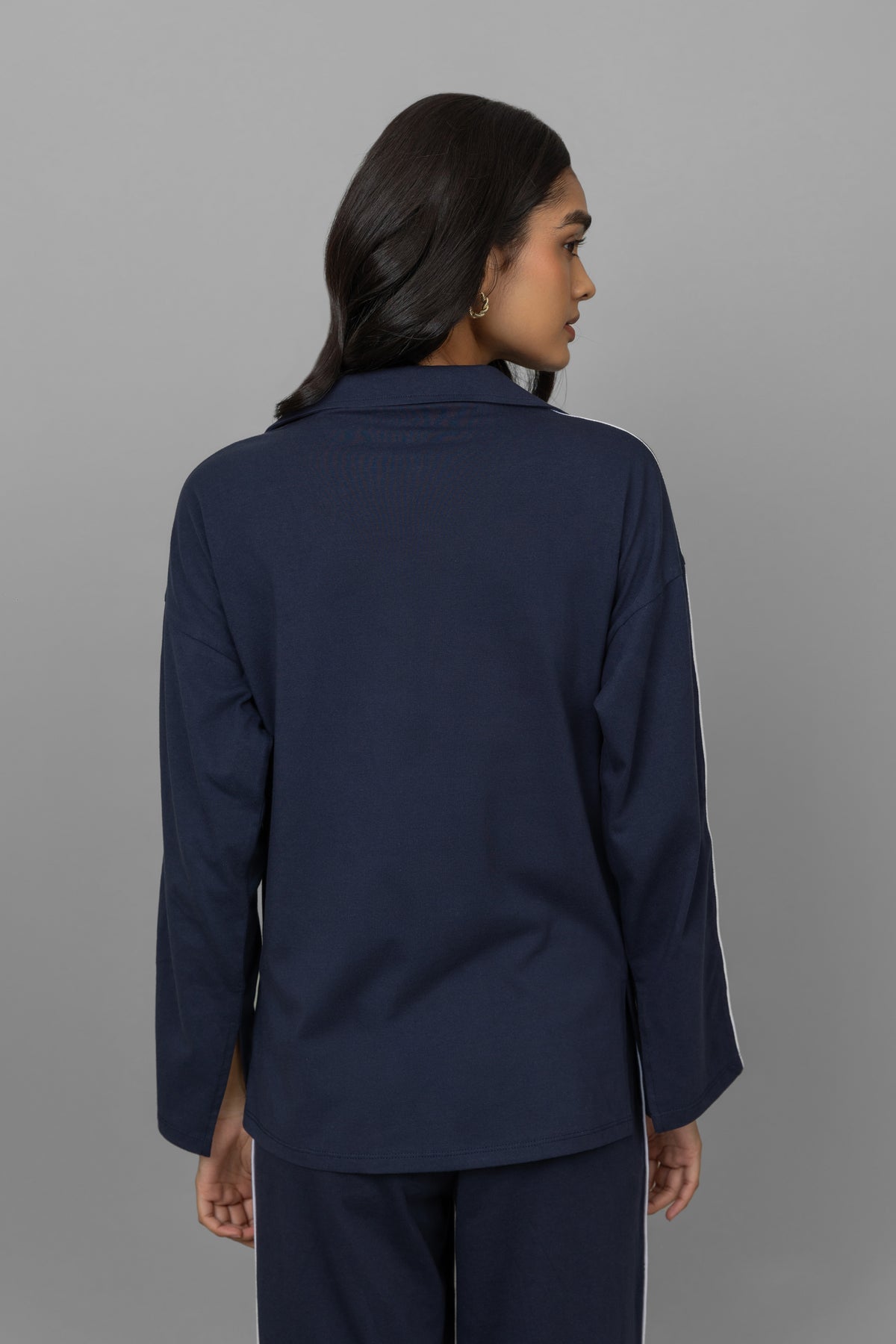 Navy button down cotton top with relaxed fit and stylish details.