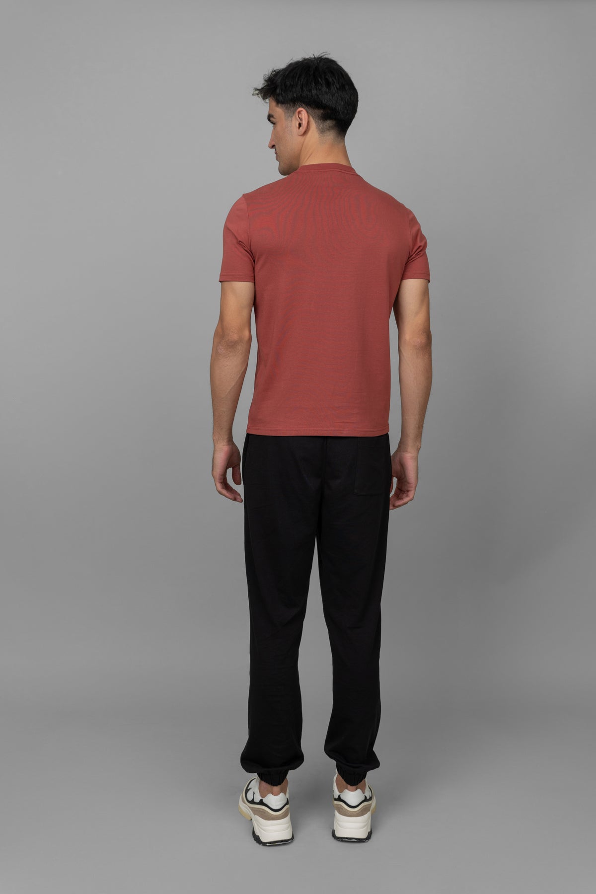 Rust men's essential t-shirt, casual style, back view, model wearing it.