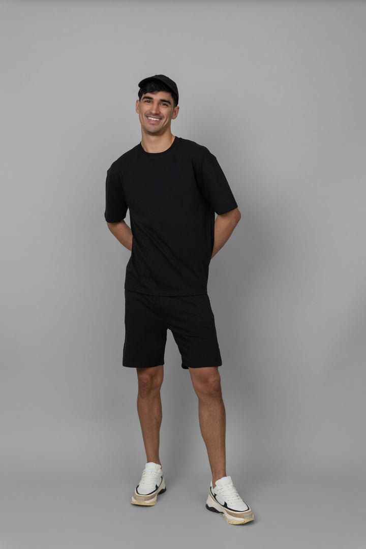 Black Men's Boxy Shorts Set displayed on a model. Comfortable and stylish outfit.