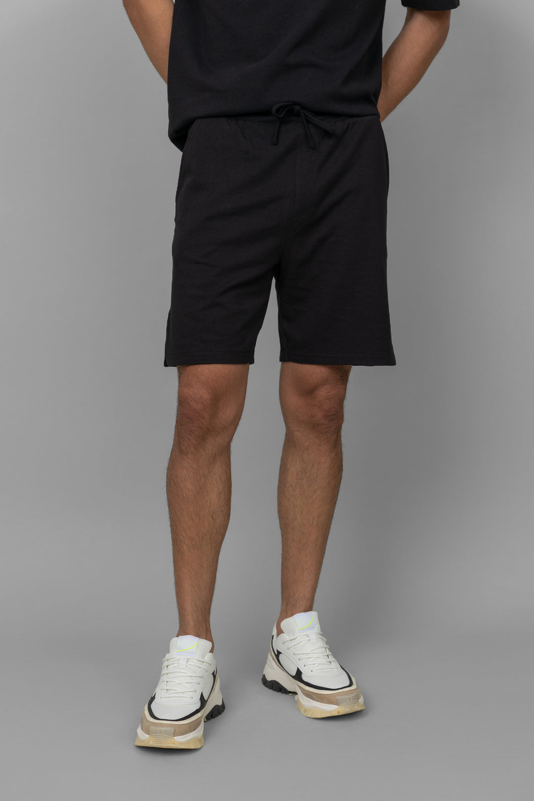 Black men's boxy shorts set for casual summer wear.