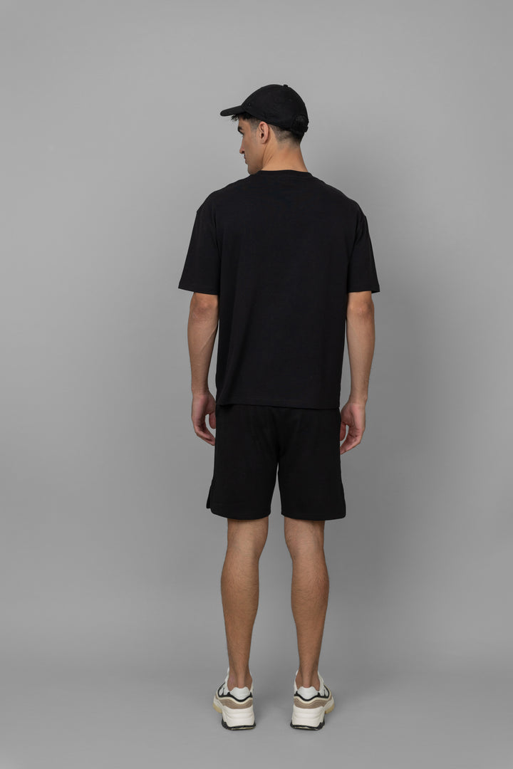 Black men's boxy shorts set featuring a relaxed silhouette.