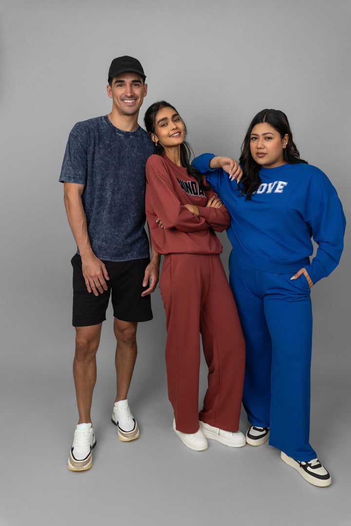 Models showcasing Blue Bamboo Terry Travel Pants in vibrant colors.