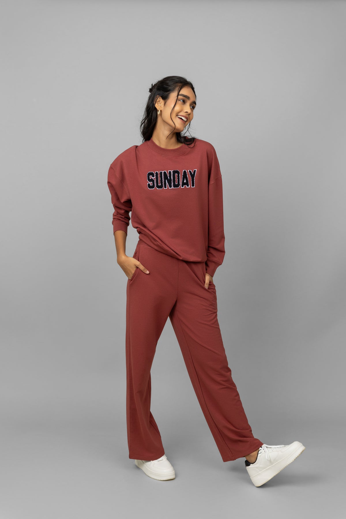 "Model wearing Sunday Travel Bamboo Terry Sweatshirt and matching pants."