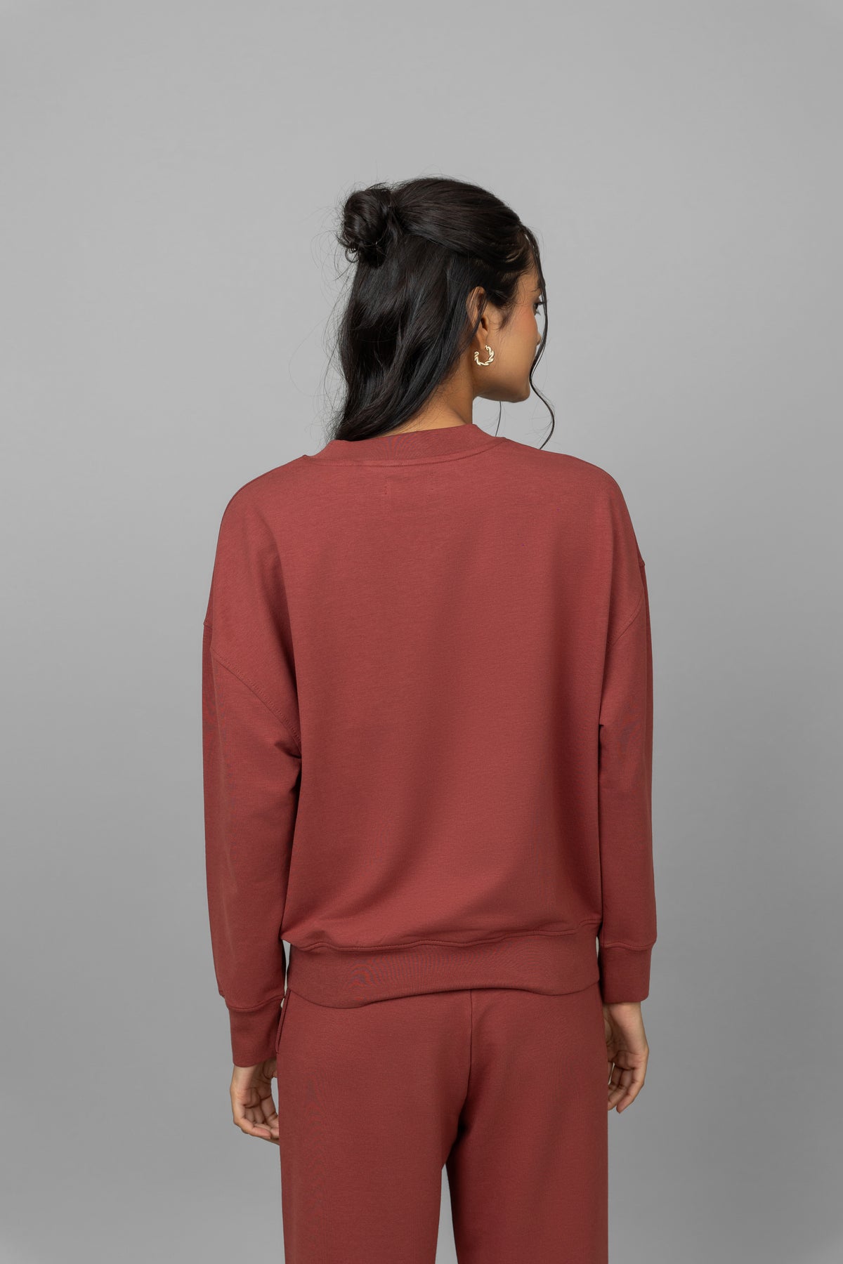Back view of Sunday Travel Bamboo Terry Sweatshirt in rust color.