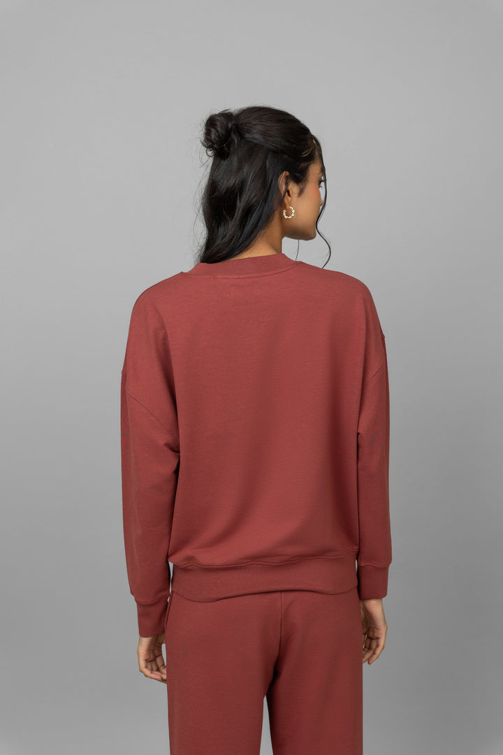Back view of Sunday Travel Bamboo Terry Sweatshirt in rust color.