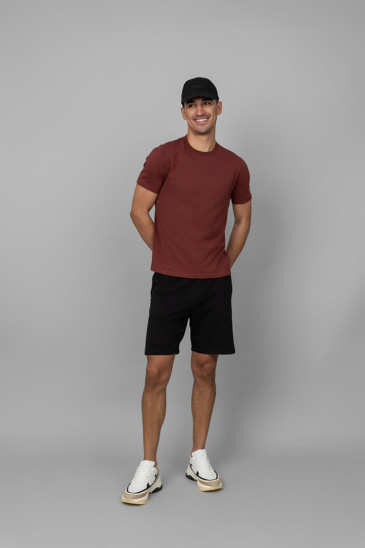 Shadow Red Men's Essential T-shirt worn by model against a gray background.