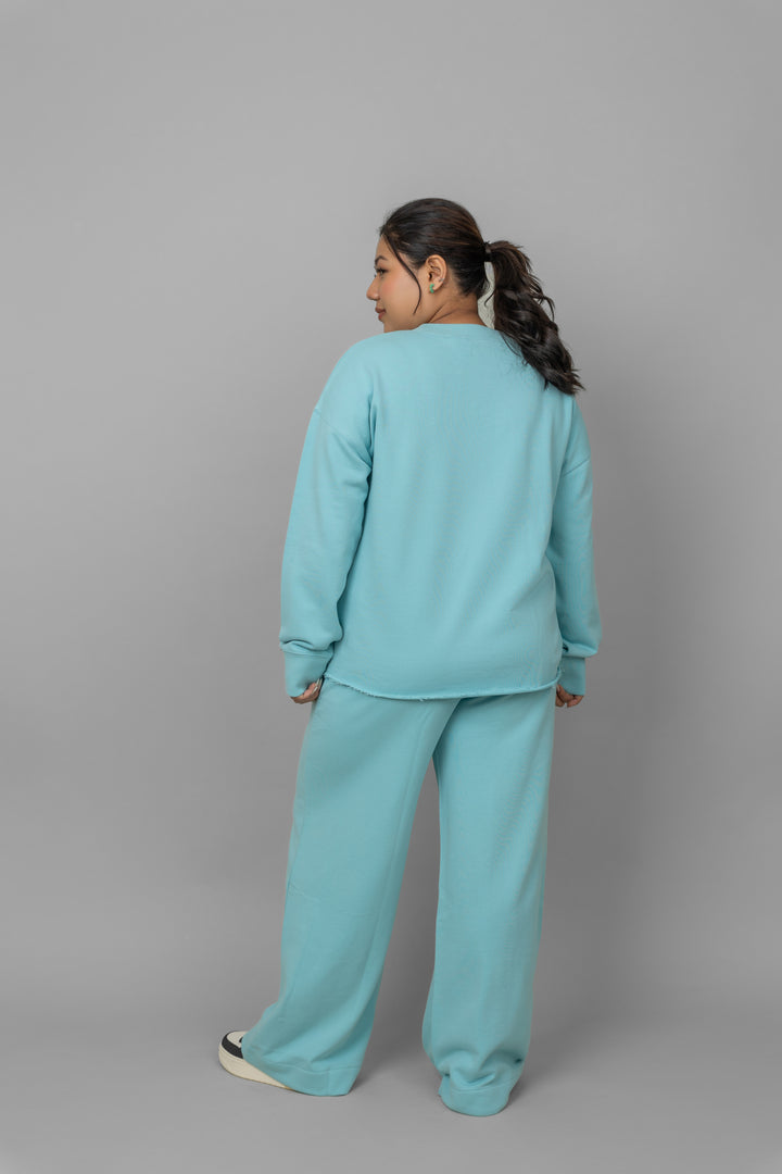 Sky blue terry ruched co-ord set worn from the back.