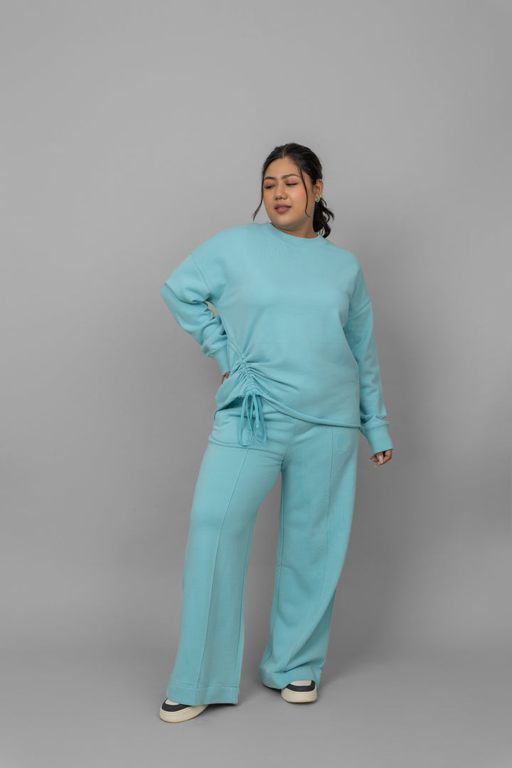 Sky blue cotton terry sweatshirt styled with matching pants.
