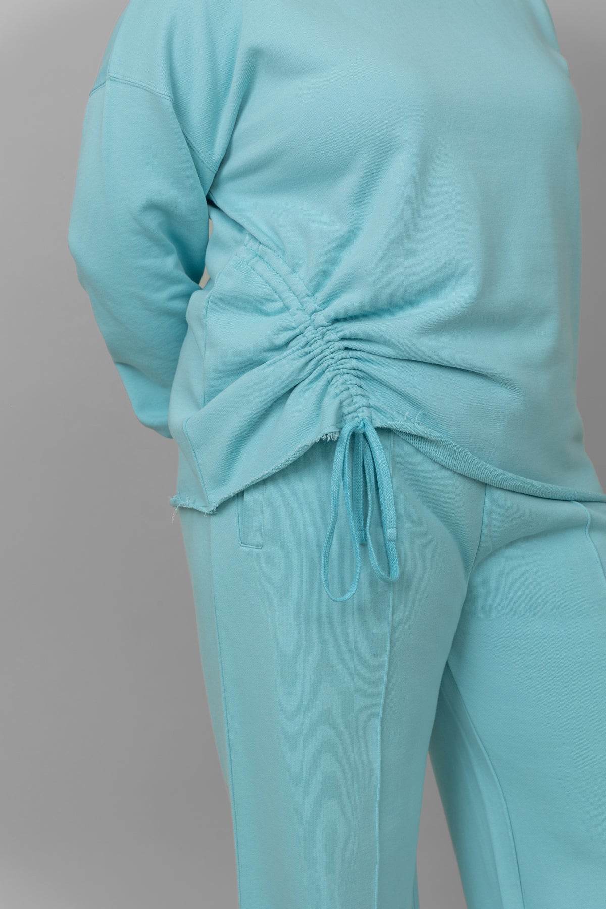 Sky blue cotton terry sweatshirt with stylish ruched detail.