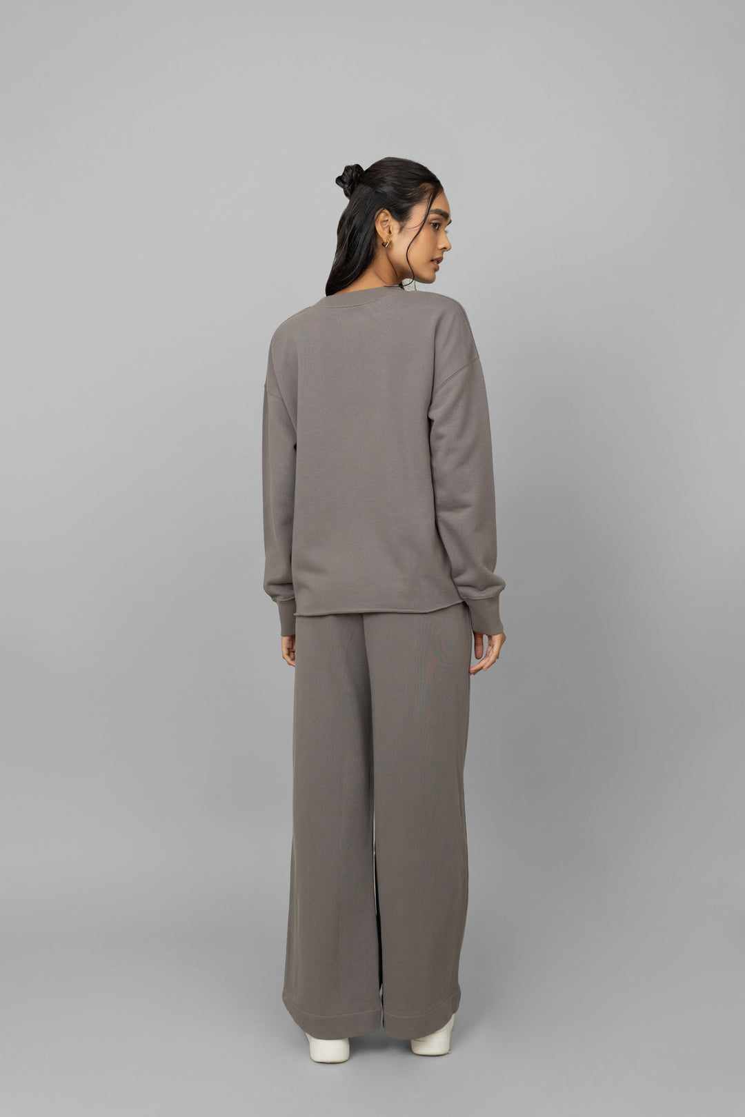 Grey terry ruched co-ord set worn by a model from behind.