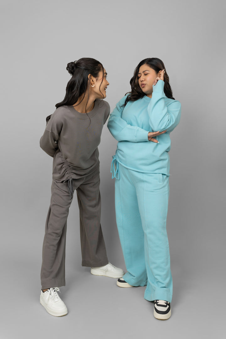 Two models wearing stylish cotton terry sweatshirts in grey and blue.