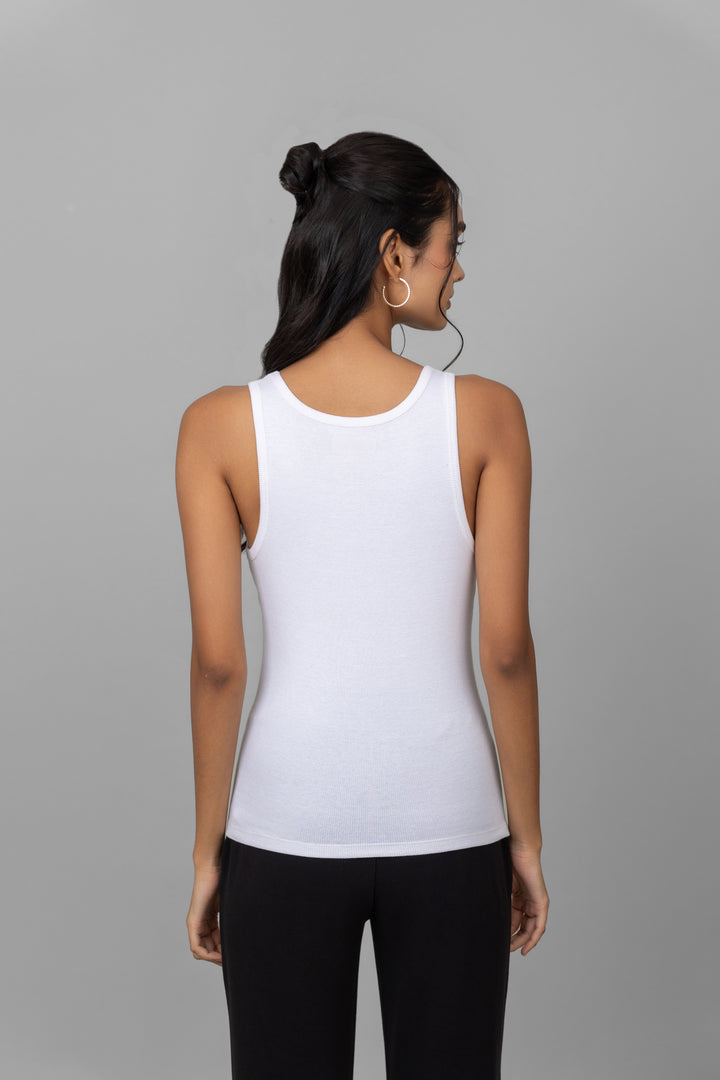 Back view of a woman wearing a white rib jogger set.