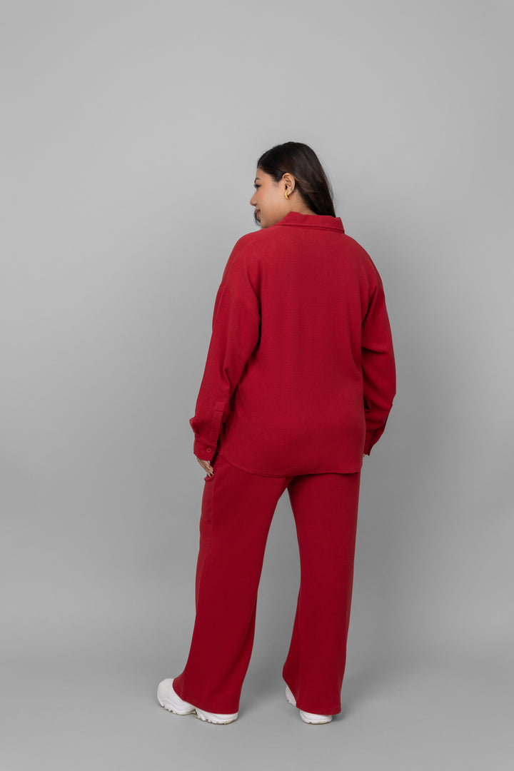 Back view of woman wearing red mini waffle multitask pants.