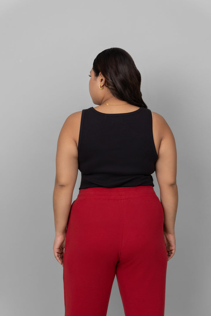 Back view of a model in a black rib jogger set.