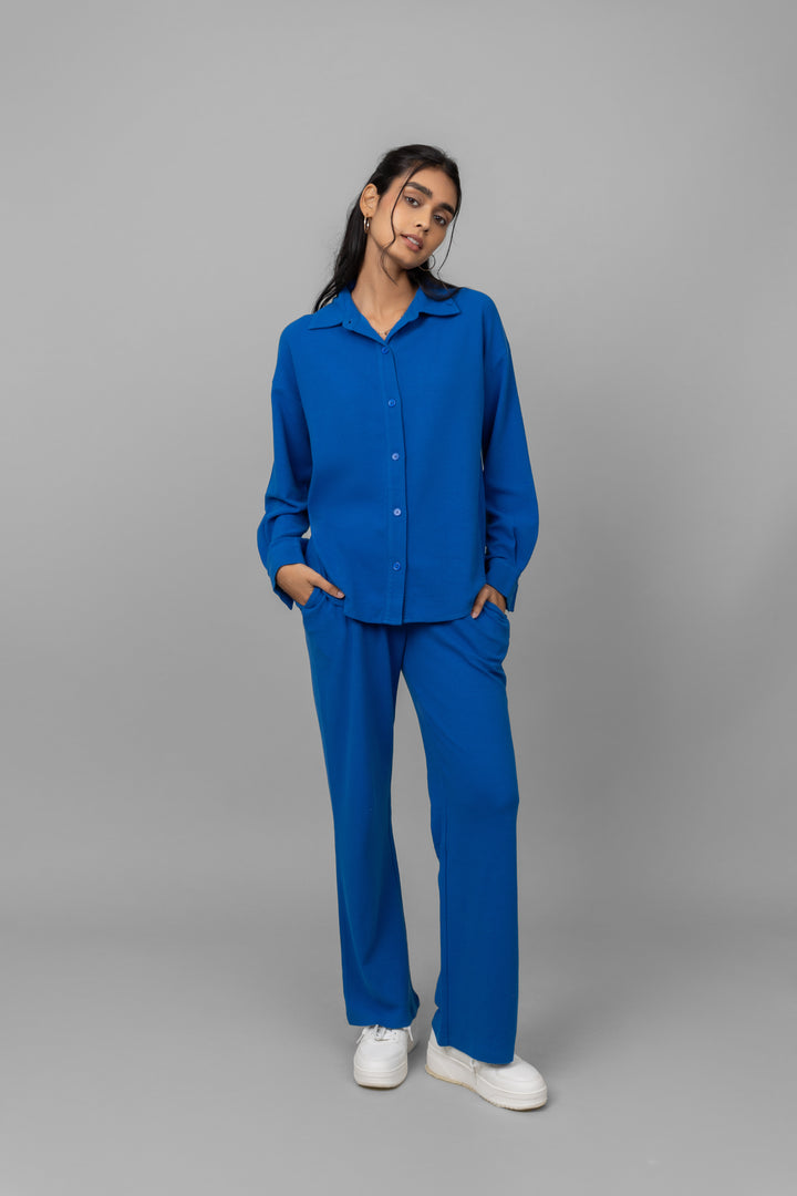 Model wearing Blue Mini Waffle MultiTask Pants with matching top.