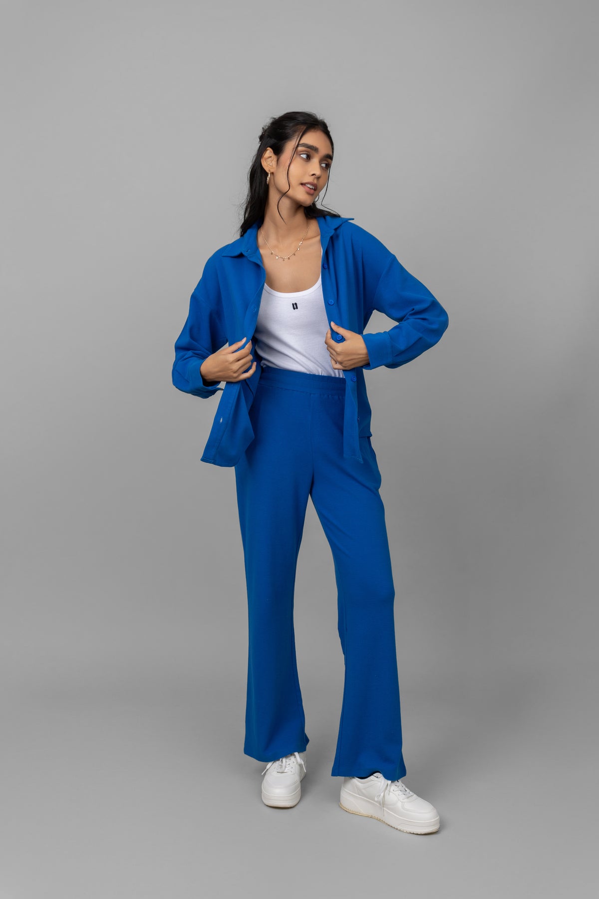 Blue Mini Waffle MultiTask Shirt on model, styled with matching pants.