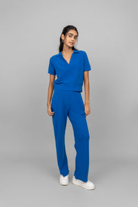 Blue mini waffle polo sweatshirt set styled with white sneakers.