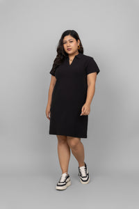 Black mini waffle polo dress model styled with sneakers.