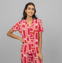Zen Half Sleeve Button T-Shirt in vibrant geometric print on model.