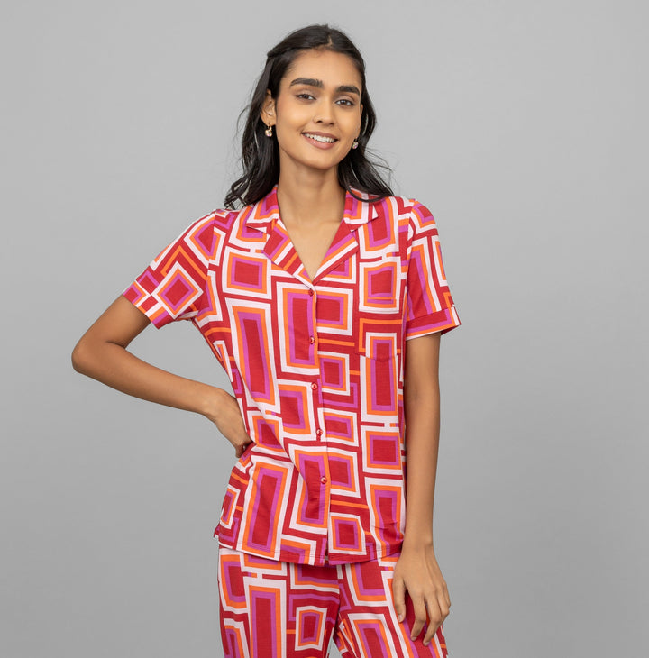 Zen Half Sleeve Button T-Shirt in vibrant geometric print on model.