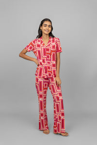 Red Zen Pajamas featuring a stylish geometric pattern on a model.