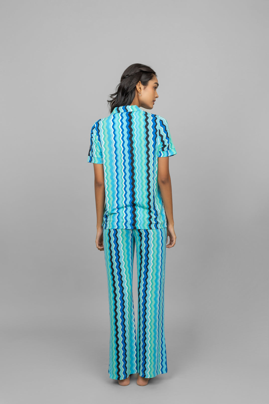 Back view of AquaWave Pajamas in wavy blue patterns.