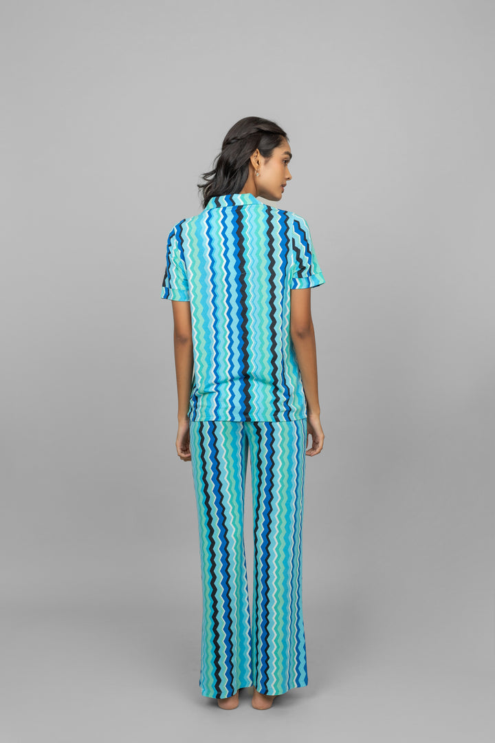 Back view of AquaWave Pajamas in wavy blue patterns.
