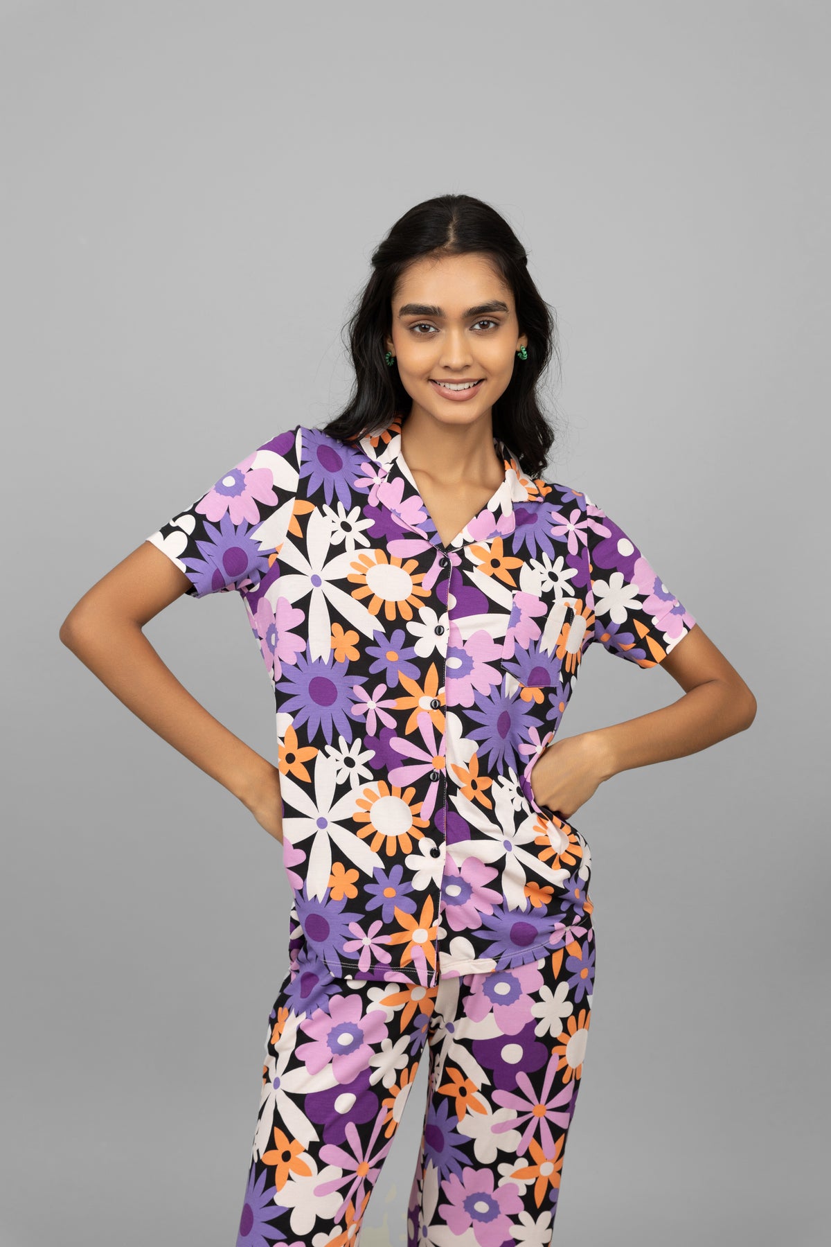 Floral half-sleeve button t-shirt model in colorful print.