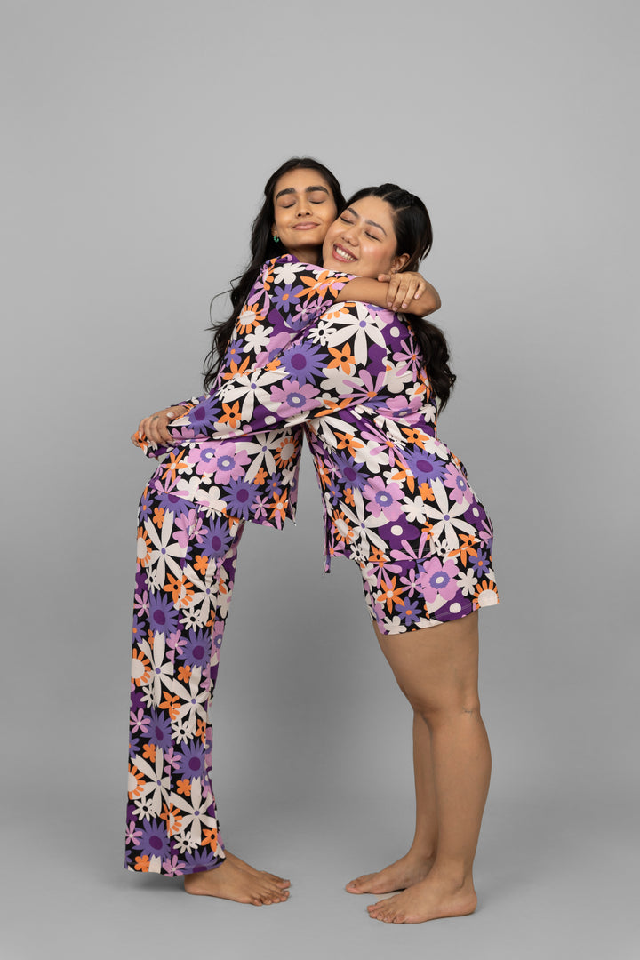 Floral pajamas hugging women in vibrant prints, celebrating comfort and style.